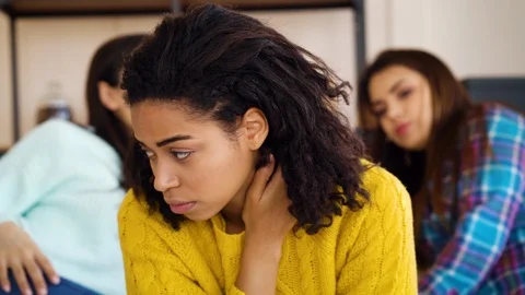 Caring friends supporting depressed black girl at home Stock Footage 125399344