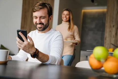 Caring husband serving serving breakfast Stock Photos