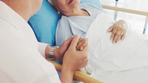 A caring interaction between a patient and a healthcare provider in a hospital Stock Footage 300353934