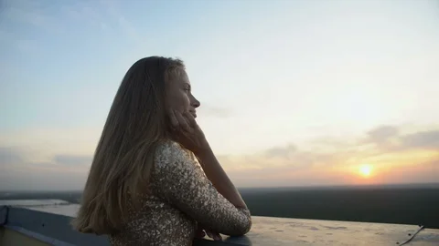 Caring man wearing jacket on girlfriend standing on balcony at home party Stock-Footage 117216229