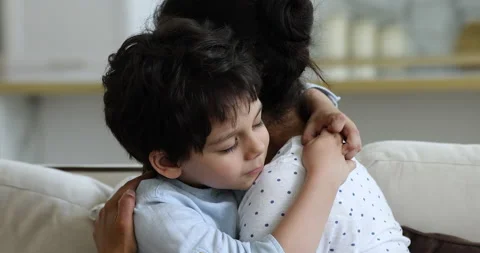 Caring mom hugging small sad boy son supporting comforting Stock Footage 165533102