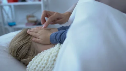 Caring mother giving small presentbox to sick daughter lying in bed, healthcare Stock-Footage 118989402