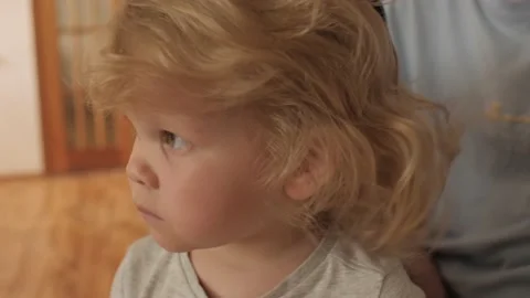 Caring mother hands combing styling hairs cute little blonde curly daughter Stock Footage 201954718