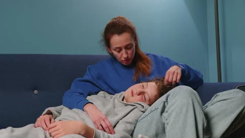Caring mother talking to her son. A teenager discusses with his parents on a Stock Footage 236244571