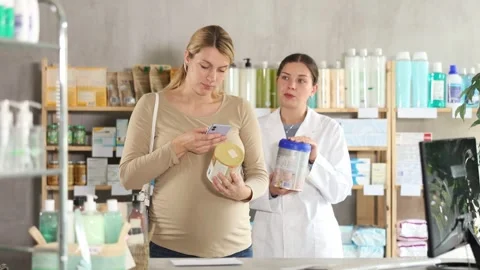 Caring pharmacist recommending other option for newborns Stock Footage 315024978