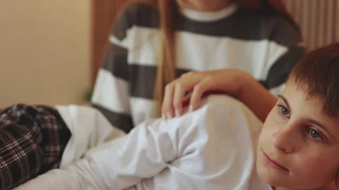 Caring sibling sharing intimate moment, younger brother nestling safely aga.. Vídeo Stock 305935008