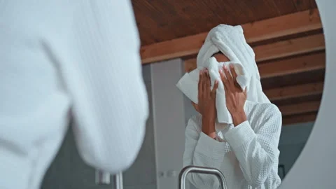 Caring for skin in bathroom Stock Footage 253378000