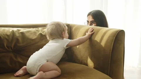 Caring Young Mom Babysitter Playing Hide And Seek With Cute Baby Girl Stock Footage 170193843