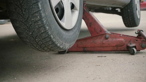 The carmaker raises the car Stock Footage 86410655
