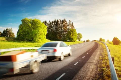Carmoving on sunny evening Stock Photos