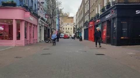 CARNABY EMPTY AS CORONAVIRUS PANDEMIC STOPS TOURISM IN LONDON LOCKDOWN, 4K Stock Footage 126521392