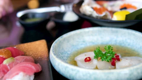 Carnegie dinner at a sushi restaurant red fish, white fish, butterfish, halibut Stock Footage 322649838