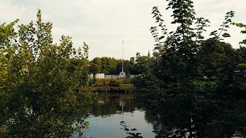 A carnival being setup across a river Video stock 160436782