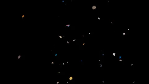 Carnival confetti falling on black backg... | Stock Video | Pond5