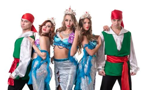 Carnival dancer team dressed as mermaids and pirates.  Isolated on white Stock Photos