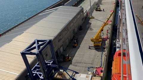 Carnival Legend baggage loading operation beside Dover Cruise Terminal 2 and Stock Footage 346798941
