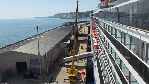 Carnival Legend docked at Dover Western Docks with Langdon Cliffs and English Stock Footage 346798900