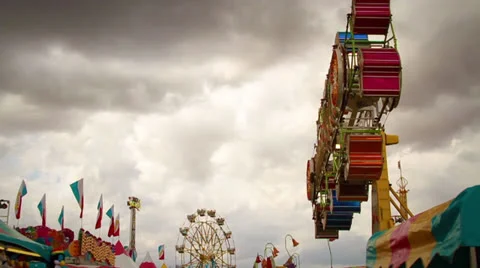 Carnival Ride with Dark Clouds Stock Footage 25593582