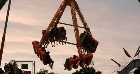 Carnival ride during sunset Stock Footage