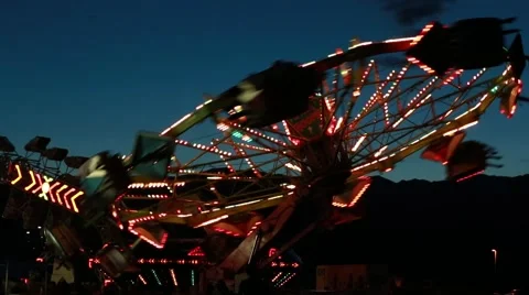 A carnival ride at night time with flashing lights Stock Footage 43071069