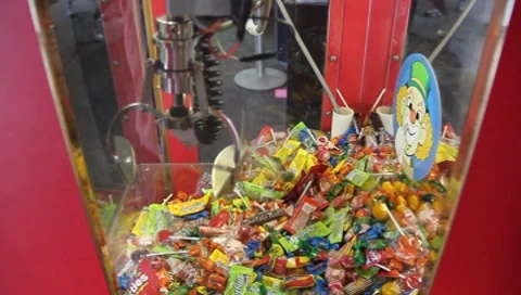 Carnival theme park games Crane Of Candy Stock Footage 7733440