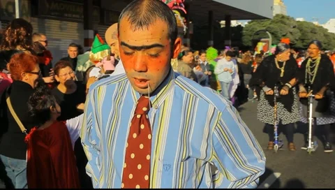 Carnival time! The Gran Cabalgata - The Grand Parade: costume of retarded person 스톡 동영상 10796009