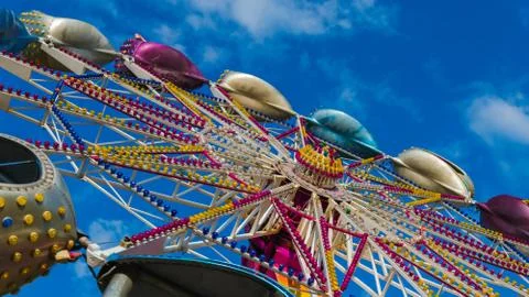 The carousel in amusement park, close-up. The Carousel is spinning against th Stock Photos