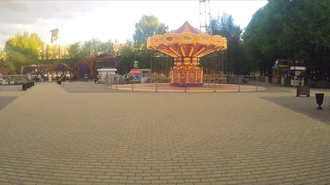 Carousel in an amusement park on summer day Stock Footage 82369738