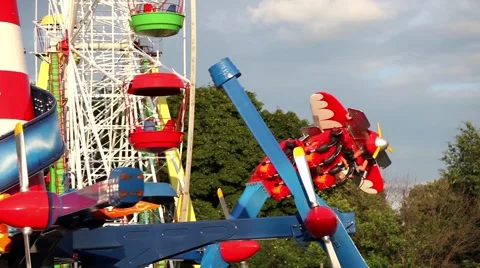 Carousel and ferry wheels in amusement park Stock Footage 52764518