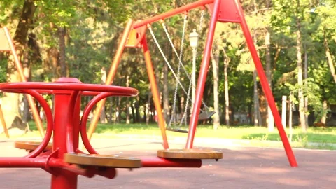 The carousel and swing rock on the playground Stock Footage 91377204