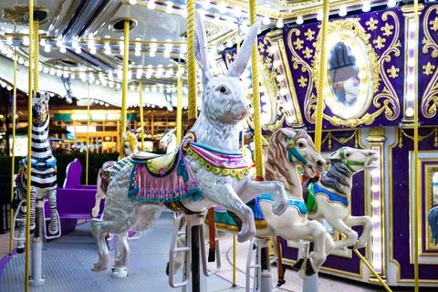 Carousel Animals at Night with Rabbit and Horses Foto stock