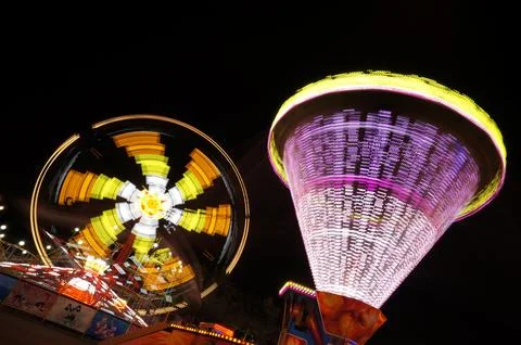 Carousel attraction in the night in action Stock Photos