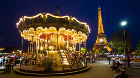 Carousel below the Eiffel Tower at twilight, Paris France - time lapse 库存影片 54125867