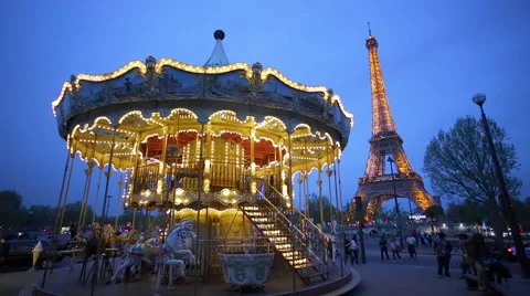 Carousel below the Eiffel Tower at twilight, Paris France 库存影片 54135936