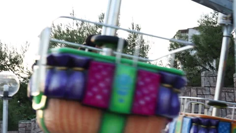 Carousel for children spinning against the sunset Stock Footage 165395559