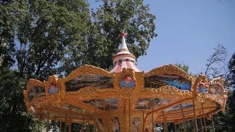 Carousel for children in the summer Park. Video stock 90408610