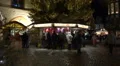 Carousel at Christmas market with happy people panning HD Footage