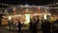 Carousel at Christmas market in historic city with cathedral HD Footage