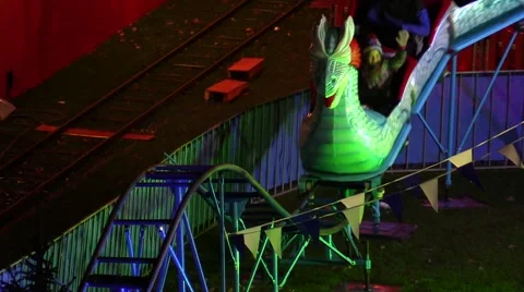 Carousel with dragon head running on roller coaster Stock Footage 44753071