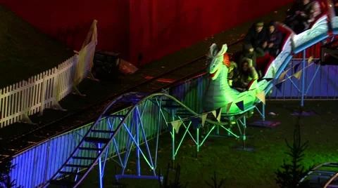 Carousel with dragon head running on roller coaster Stock Footage 44753073