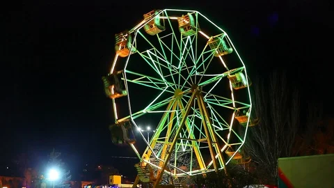 Carousel Ferris wheel turns Stock Footage 122976722