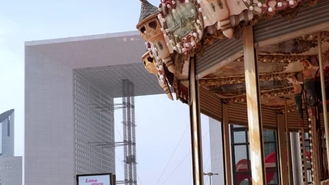 Carousel with Great Arc of the Defense on the background in Paris Stock Footage 113602886