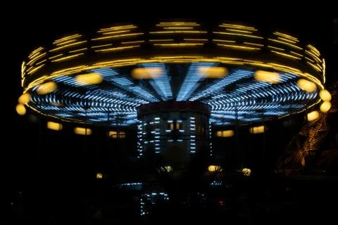 Carousel (merry-go-round) time lapse photo shot in late evening light at a Stock Photos
