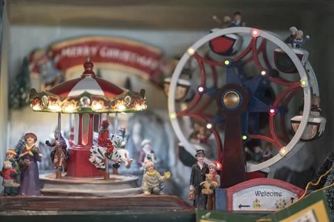 Carousel ornament and merry-go-round wheel with miniture people Stock Photos