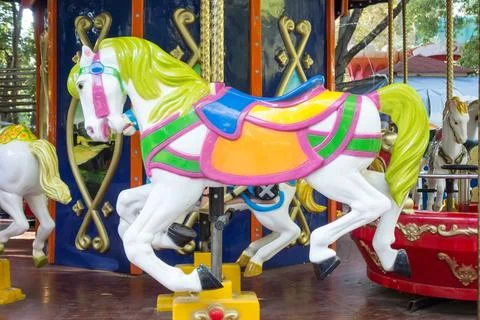 Carousel ride with horses Stock Photos