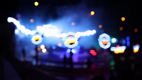 Carousel ride at night in action with many defocused lights Stock Footage 120527321