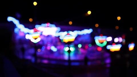 Carousel ride at night with many defocused colorful lights Stock Footage 120527306
