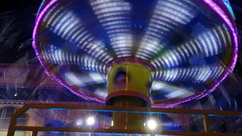 Carousel ride spinning around at night Stock Footage 102428024