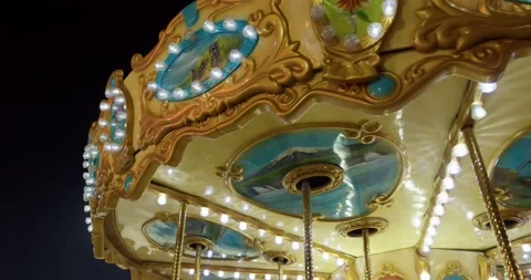 Carousel rooftop moving in slow motion at night Stock Footage 132284208