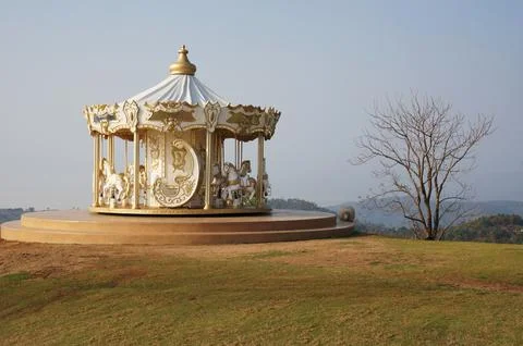 Carousel in the sunny day with a view Foto stock